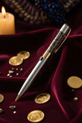 Crystal Manifestation Pen on royal burgundy velvet with gold coins